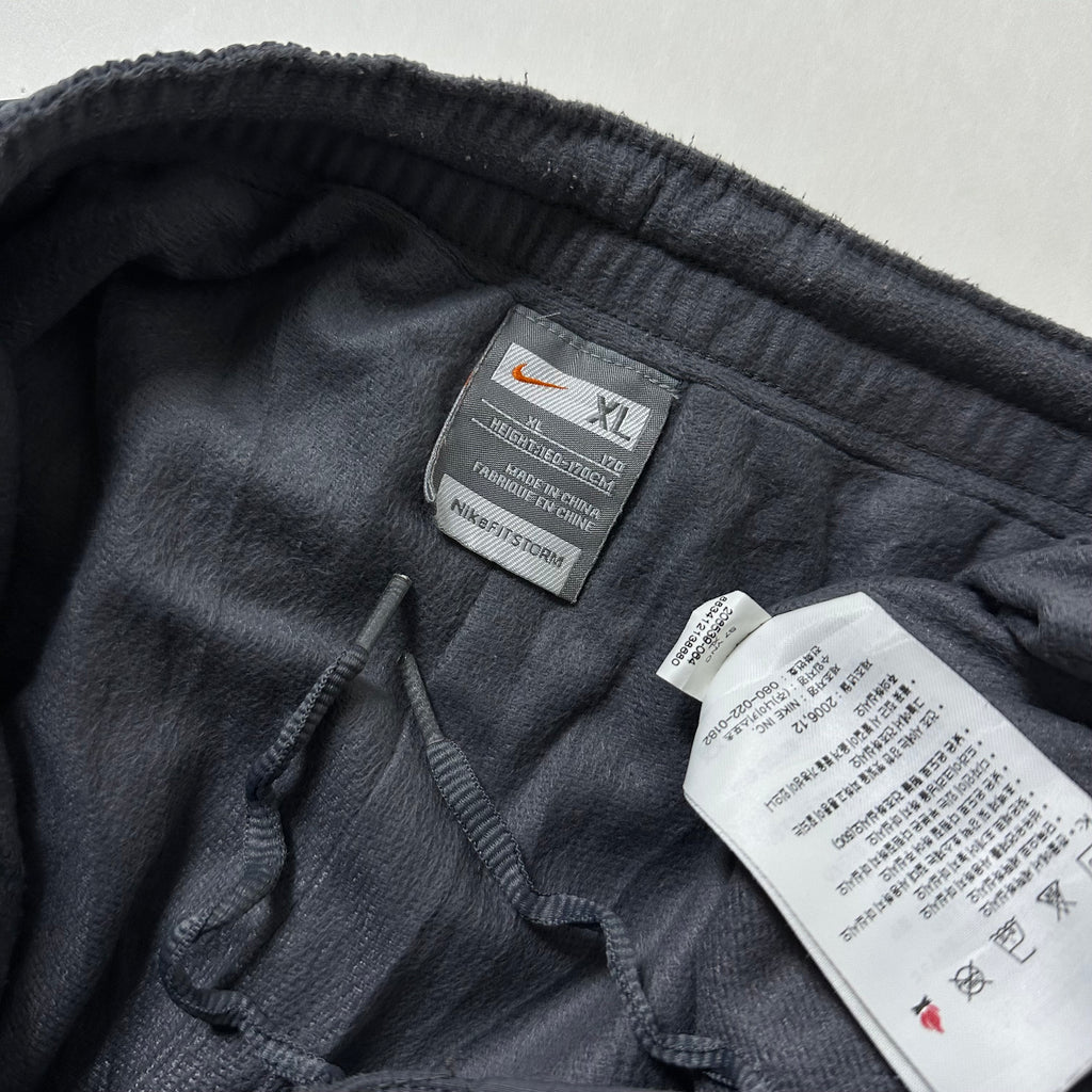 Vintage Y2K Nike Track Pants in Gray (Size 26-34)