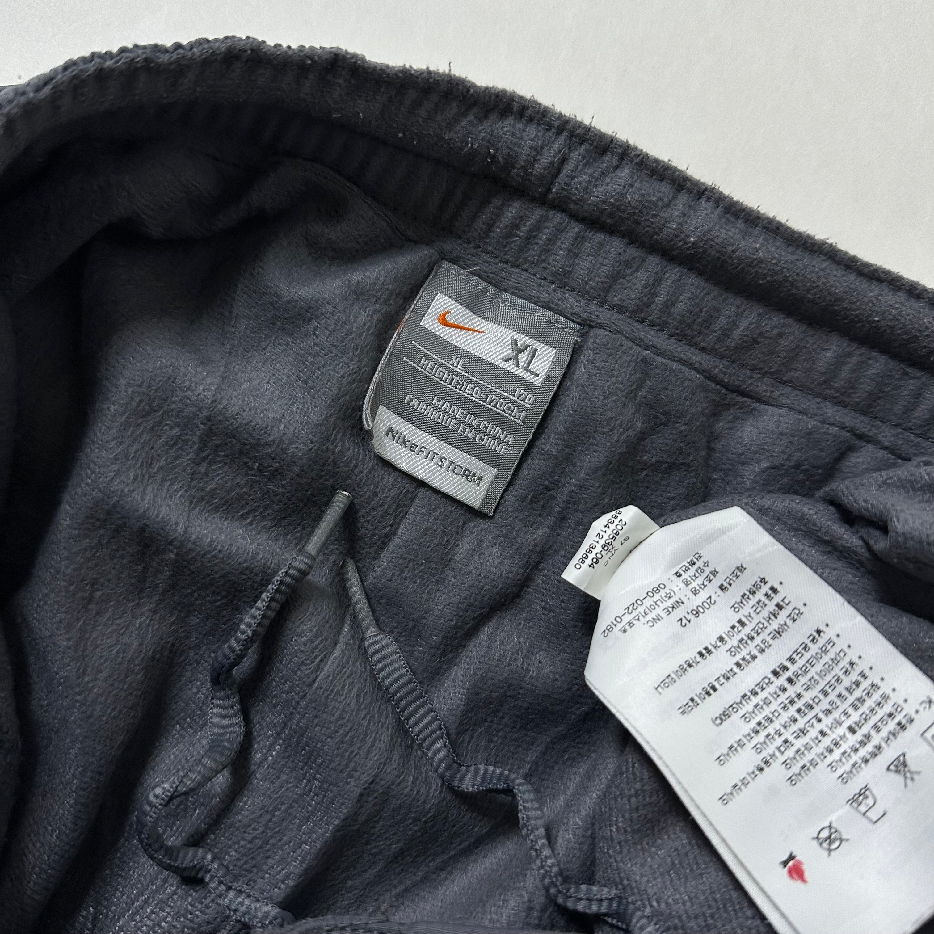 Vintage Y2K Nike Track Pants in Gray (Size 26-34)