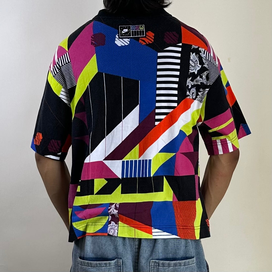 Nike Sportswear Loose Fit  Multi-colored Geometric Pattern T-shirt (Size Small) - SOLD