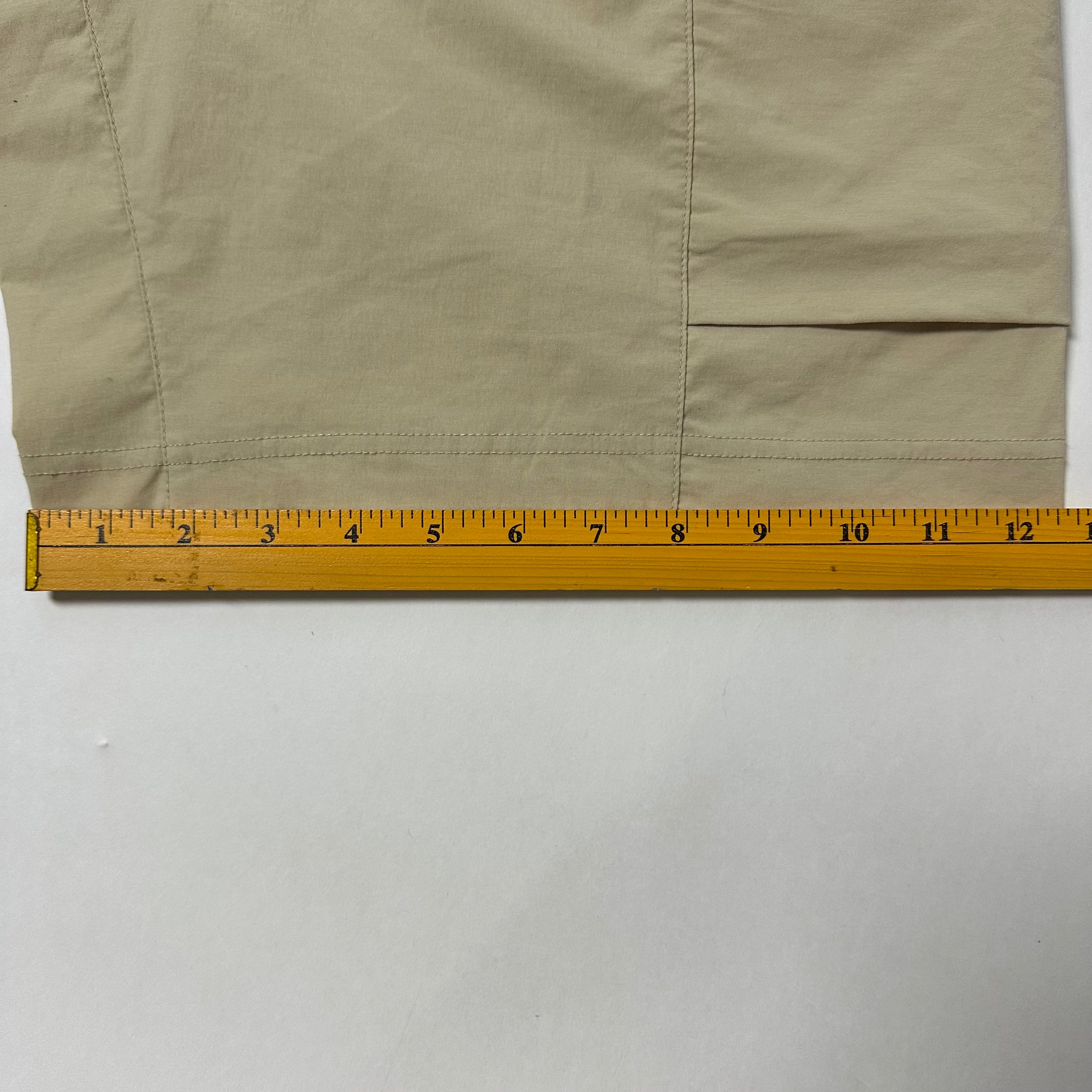 Nike Men’s Sportswear Woven Cargo shorts in a beige color featuring a zippered utility pocket (Size 32-36)