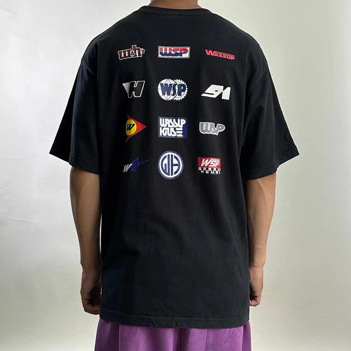 Wassup House Multi-Logo Racing Graphic T-Shirt in Black (Size Large)