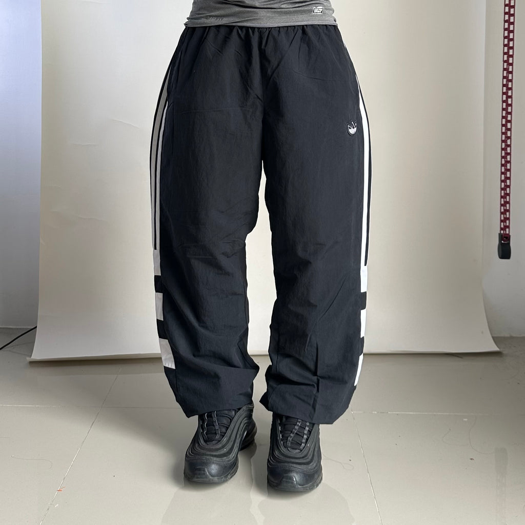 ADIDAS Originals Track Pants in Black featuring Trefoil Logo on the leg (Size 32-38)