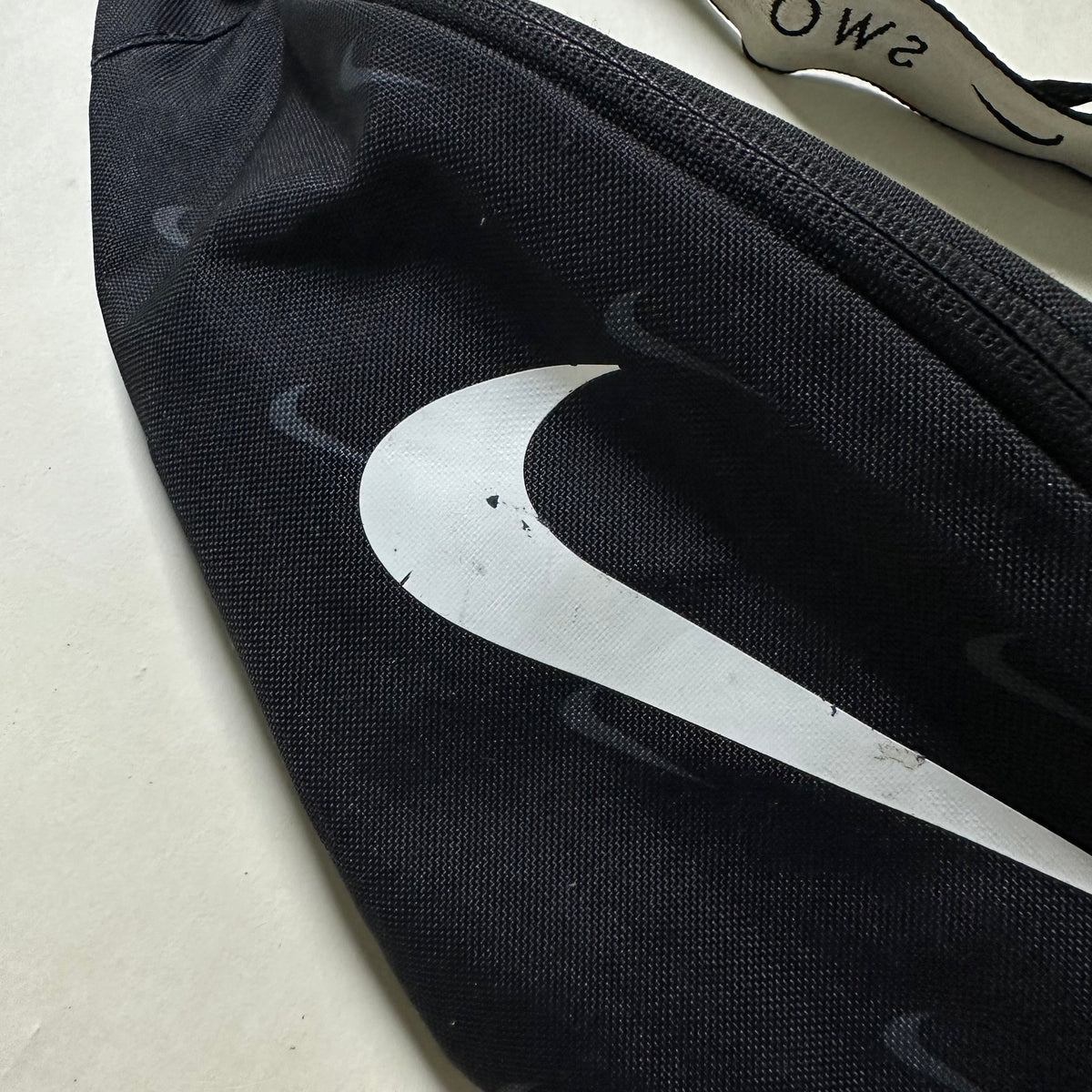 Nike Heritage Belt Bag “All Over Swoosh” in Black