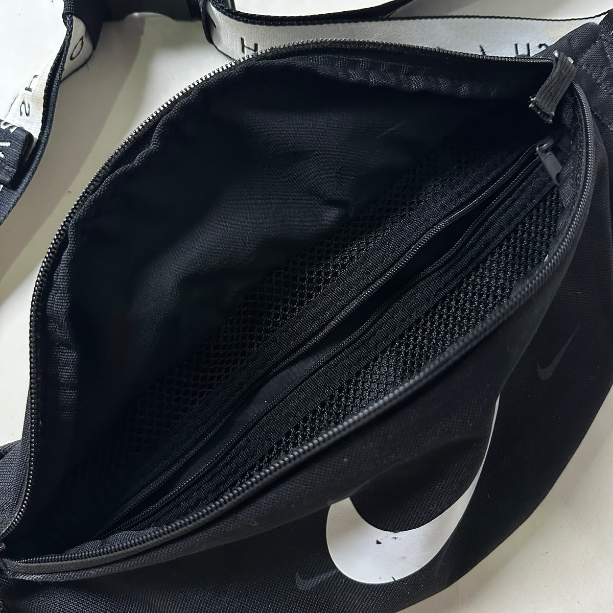Nike Heritage Belt Bag “All Over Swoosh” in Black