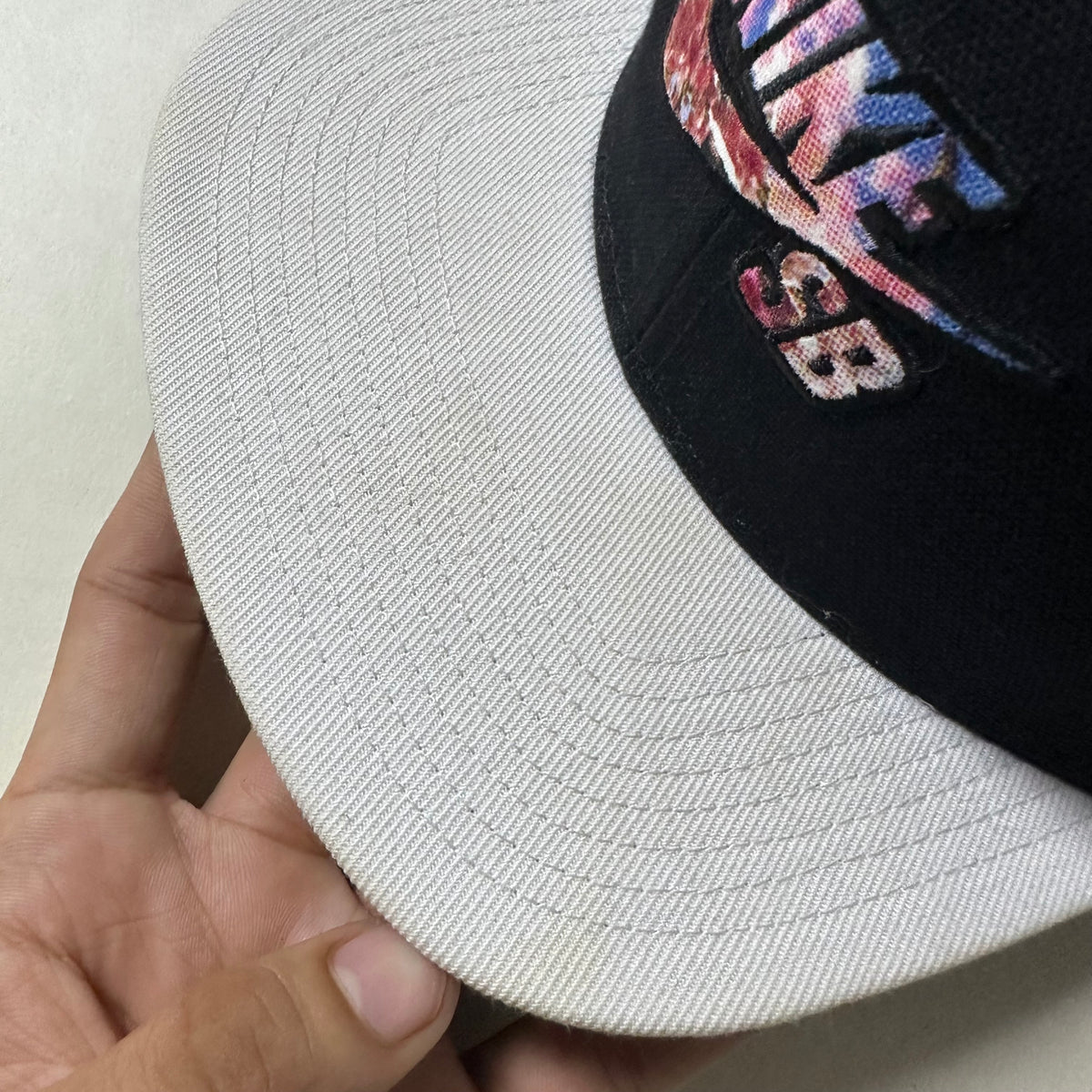 Nike SB Snapback Cap in Black & White with Floral Logo (One Size)