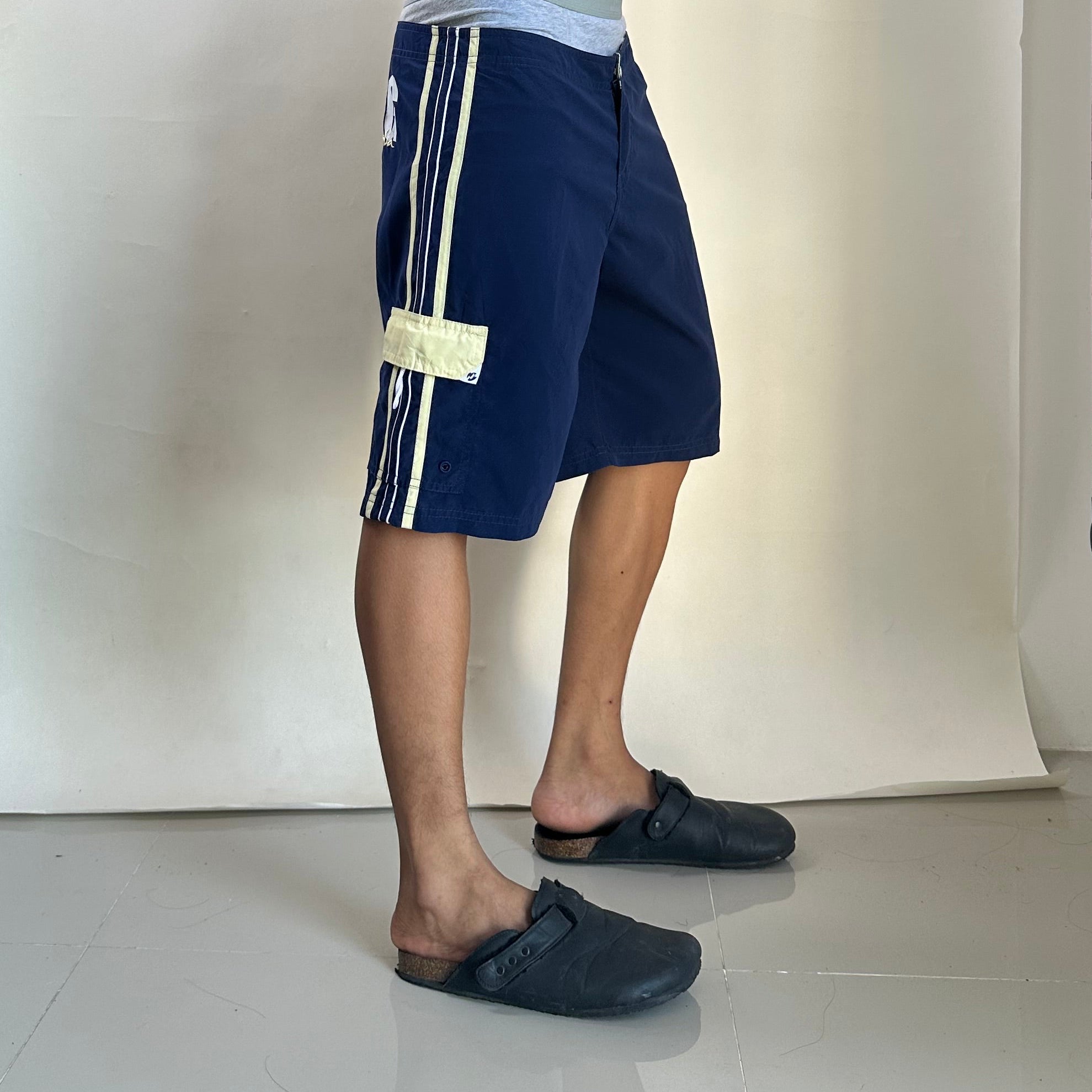 2000’s Billabong Board Shorts in Navy Blue and Yellow Color way Size 32