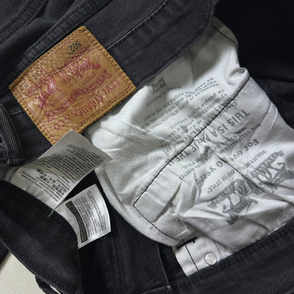 Levi’s 502 Regular Taper Jeans in Black Wash (Size 34)
