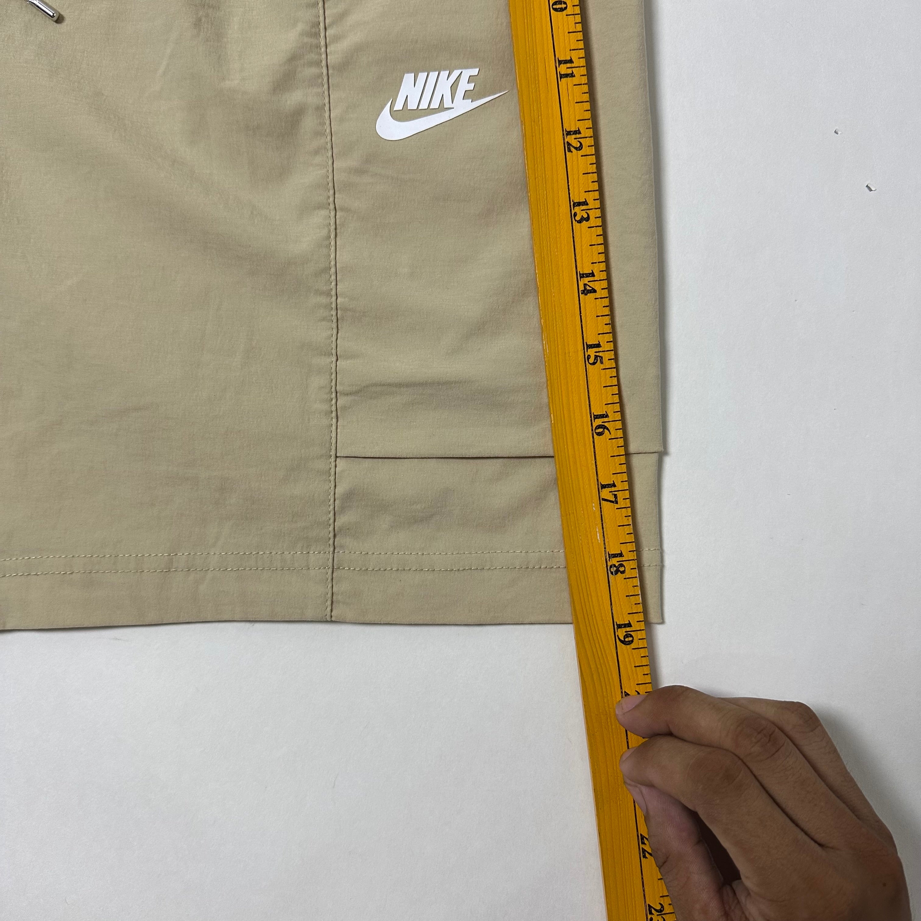 Nike Men’s Sportswear Woven Cargo shorts in a beige color featuring a zippered utility pocket (Size 32-36)